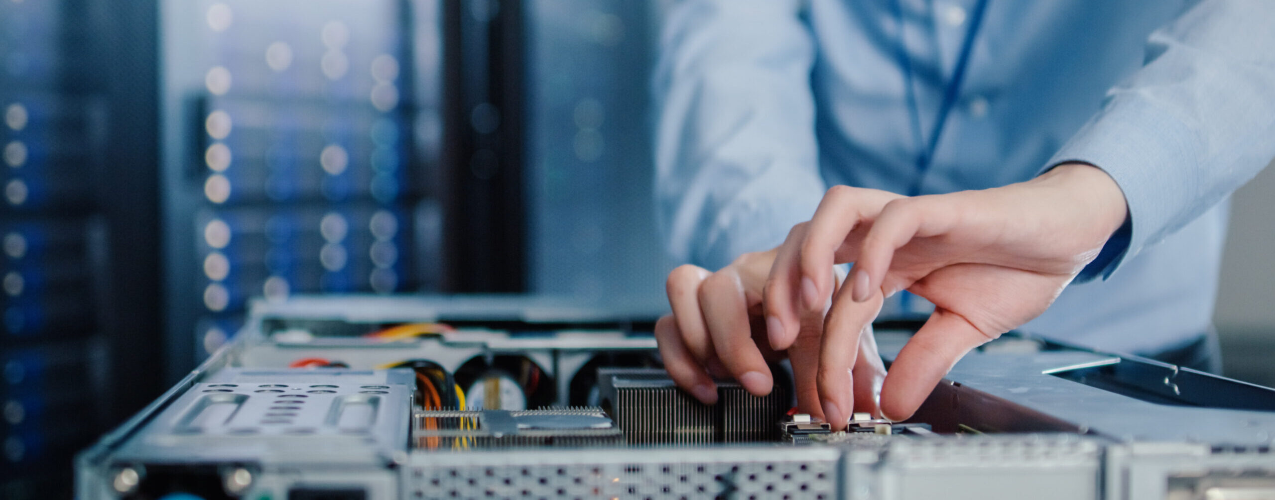 Close-up Shot in Modern Data Center: IT Engineer Installs New Hardware for Server Rack. IT Specialist Doing Maintenance, Running Diagnostics and Updating Hardware.